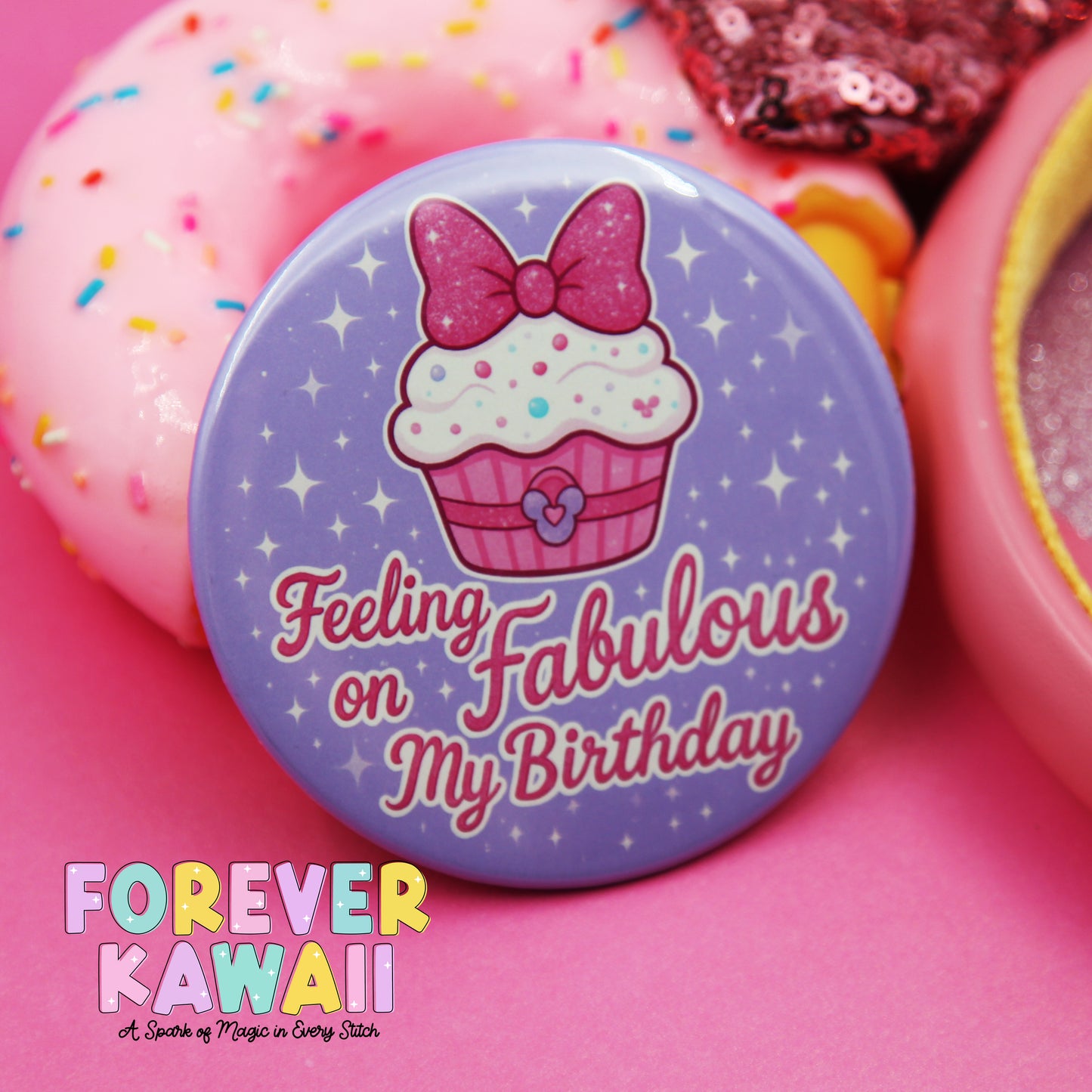 a purple button with a cupcake design and the text "Feeling Fabulous on My Birthday" on it, surrounded by pink and yellow sprinkles.