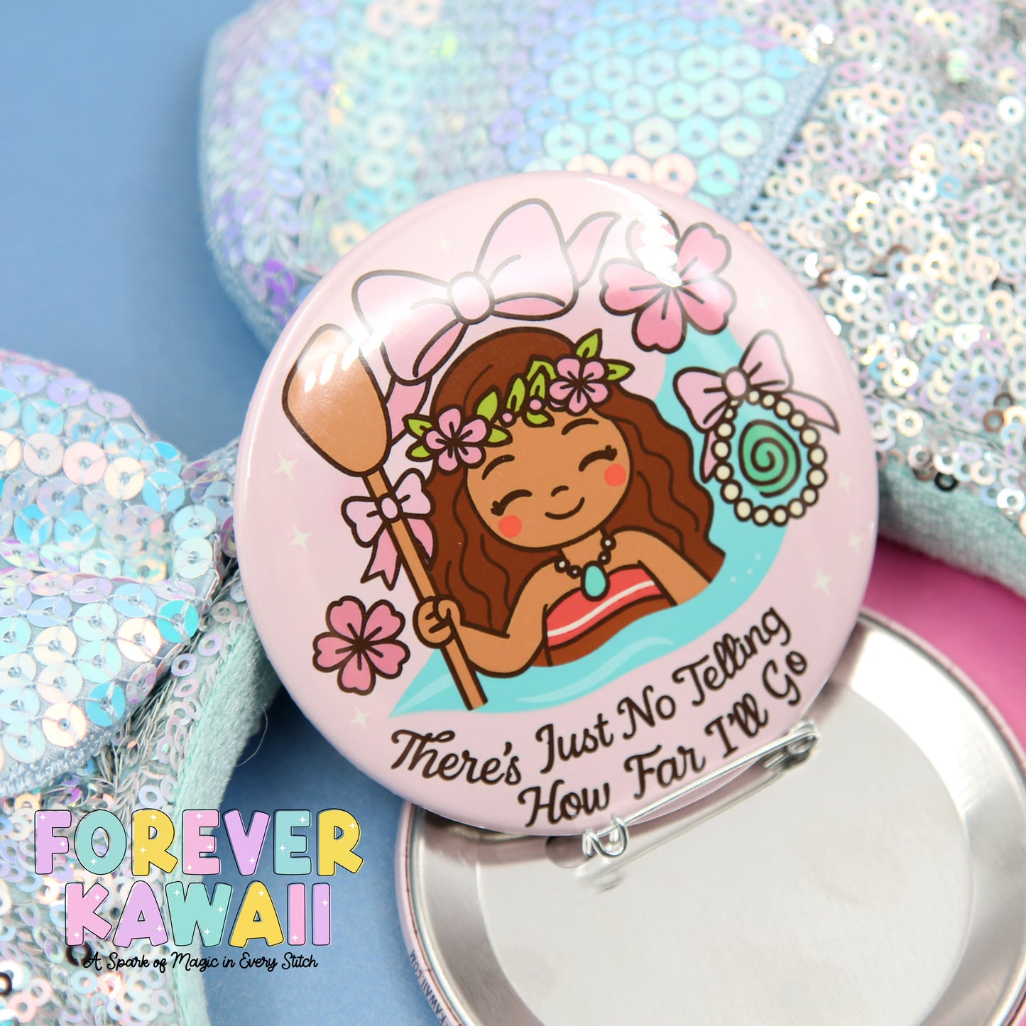 A pink pin with a cartoon girl wearing a flower crown and holding a broom, surrounded by flowers and text that says "There's Just No Telling How Far I'll Go".
