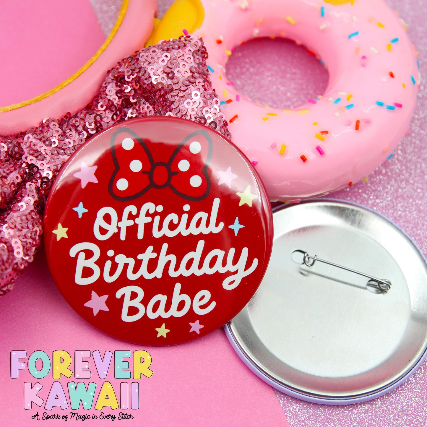 a red pin with the text "Official Birthday Babe" and a pink donut with sprinkles, along with a silver pin and a pink sequin fabric.