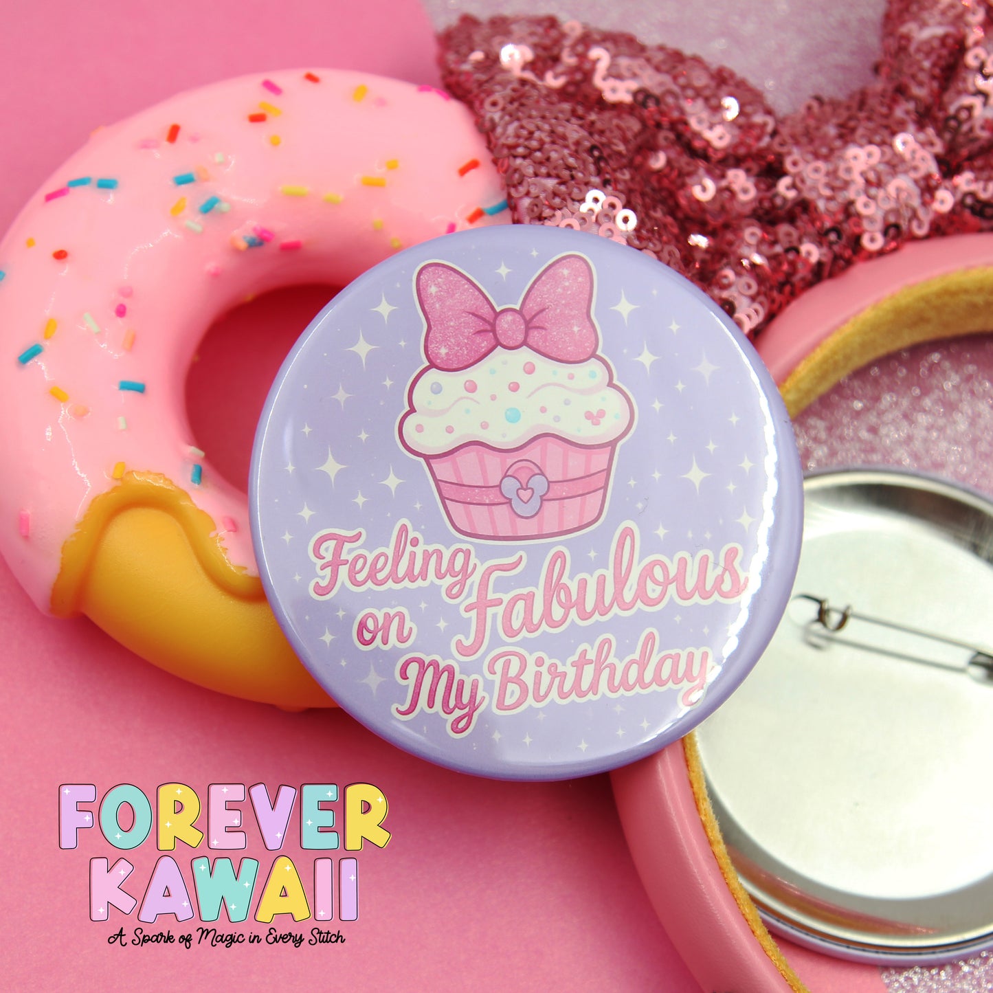a pink donut with sprinkles, a purple button with a cupcake and bow, and a pink sequin headband.