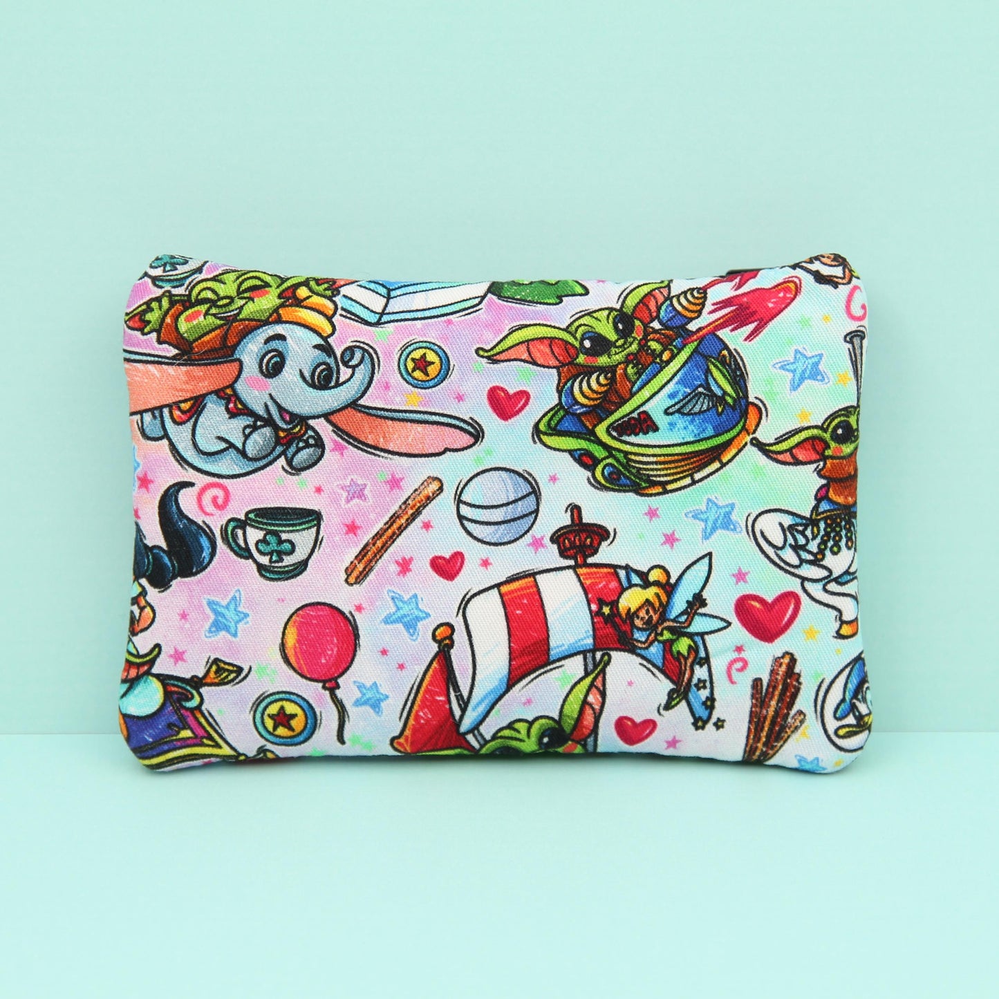 Handmade Baby Alien zipper pouch in whimsical theme park design, perfect for holding cash, cards, and passes