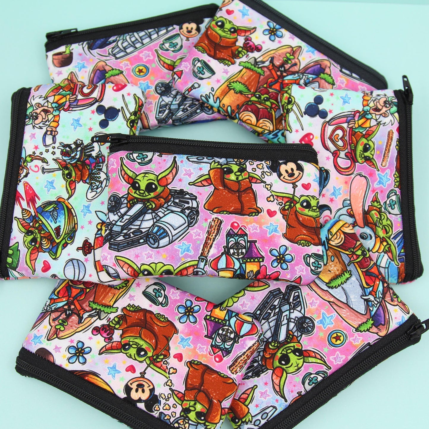 Handmade Baby Alien zipper pouch in whimsical theme park design, perfect for holding cash, cards, and passes