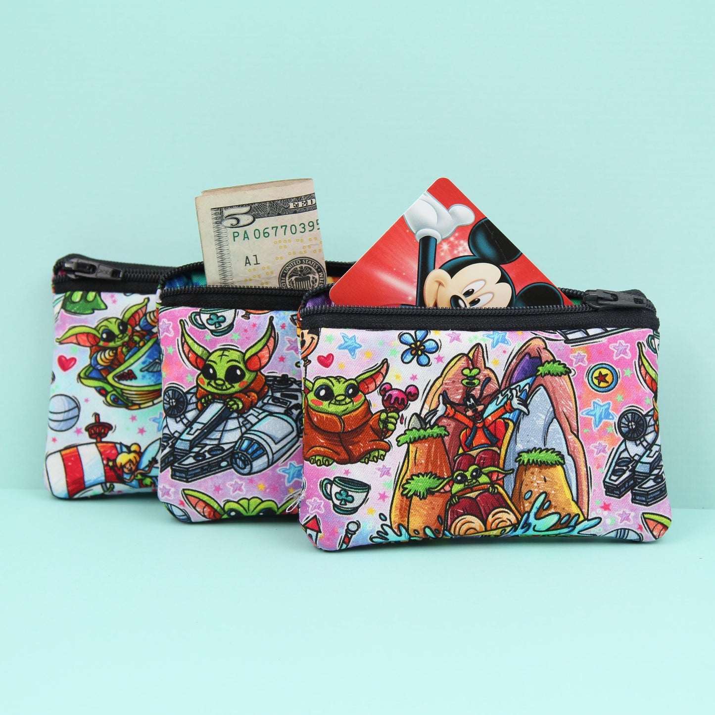 Handmade Baby Alien zipper pouch in whimsical theme park design, perfect for holding cash, cards, and passes