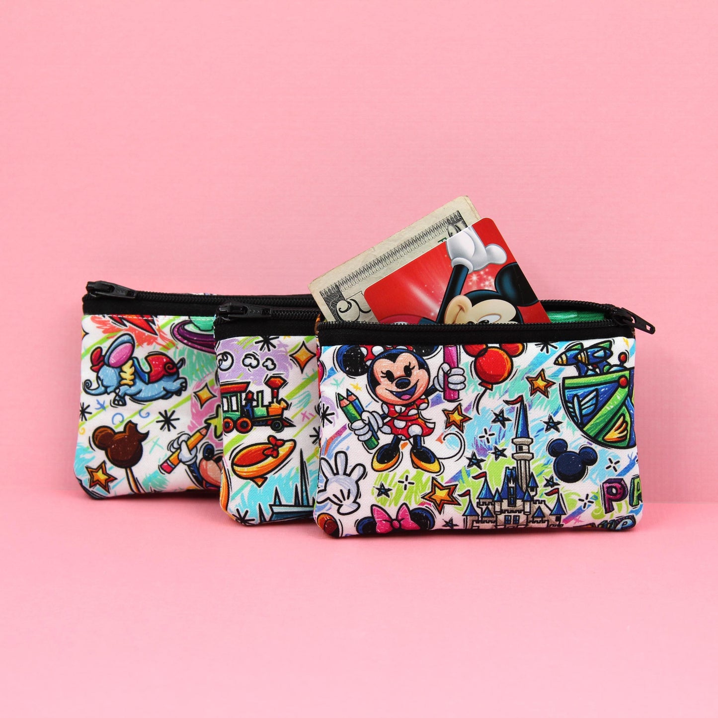 Handmade zipper pouch featuring an art-inspired design with colorful characters and paint details, perfect for holding coins, cards, and other small essentials. Ideal for theme park visits or as a creative gift for art lovers.