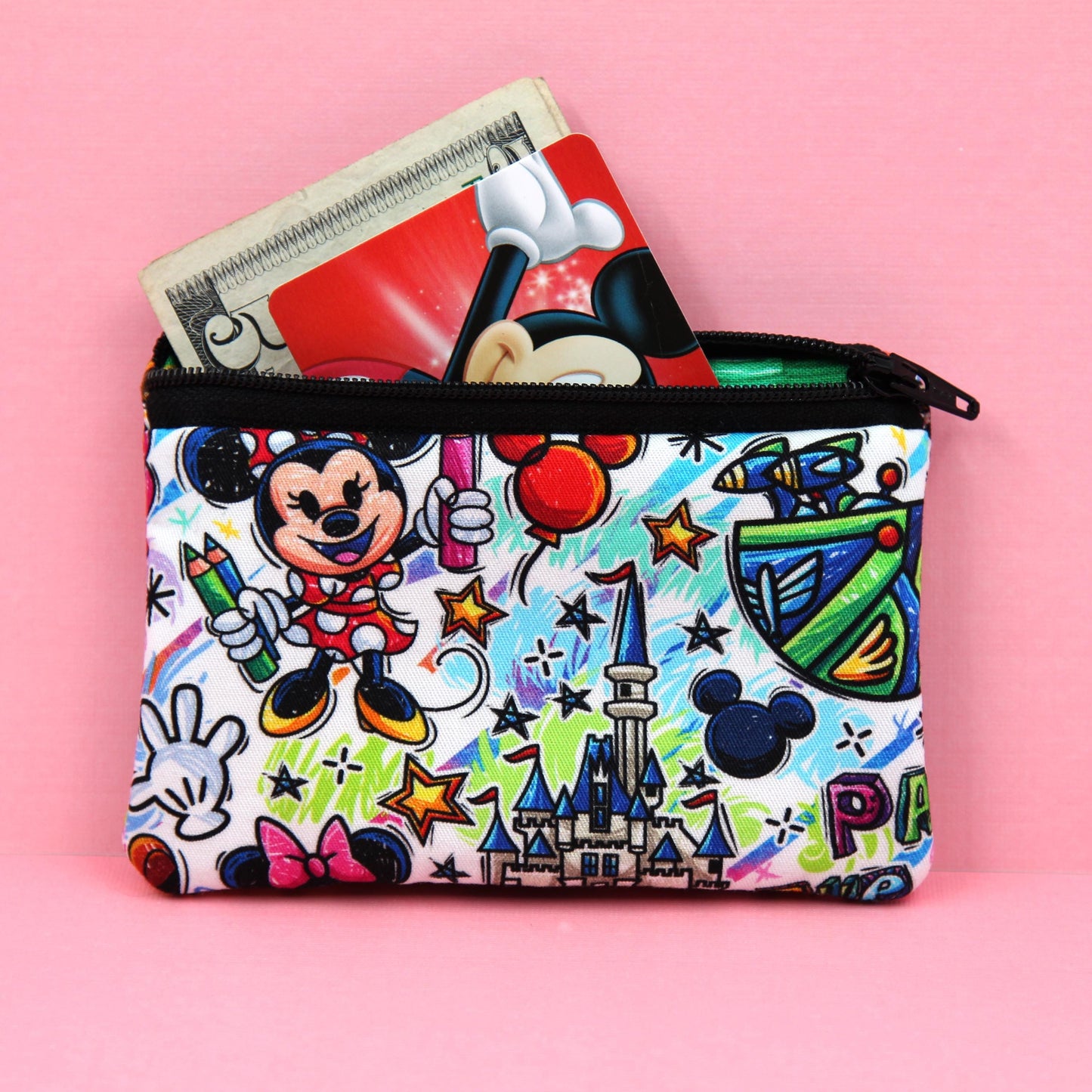 Handmade zipper pouch featuring an art-inspired design with colorful characters and paint details, perfect for holding coins, cards, and other small essentials. Ideal for theme park visits or as a creative gift for art lovers.