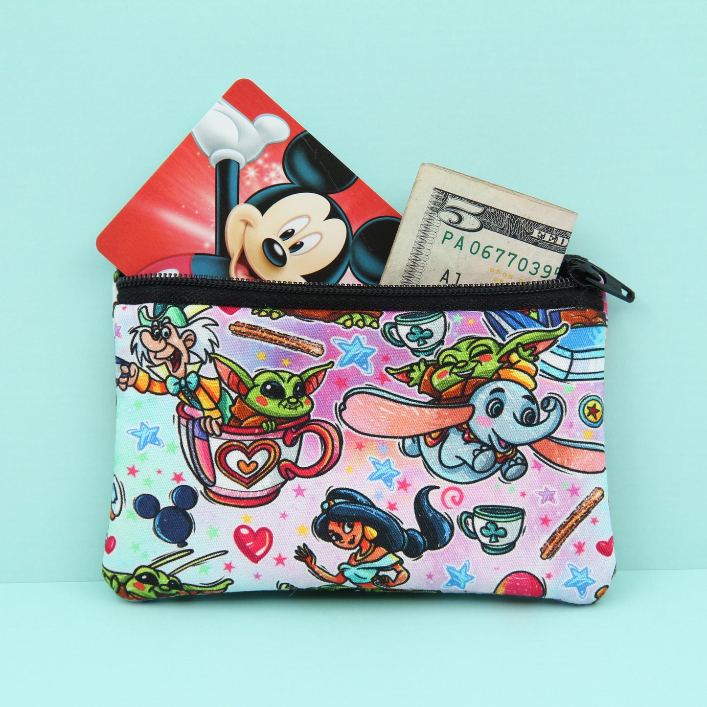 Handmade Baby Alien zipper pouch in whimsical theme park design, perfect for holding cash, cards, and passes
