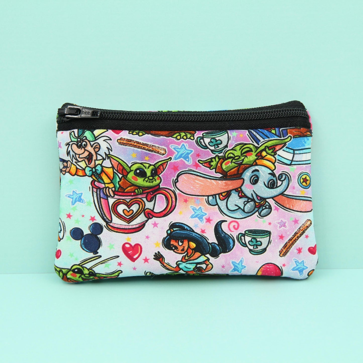 Handmade Baby Alien zipper pouch in whimsical theme park design, perfect for holding cash, cards, and passes