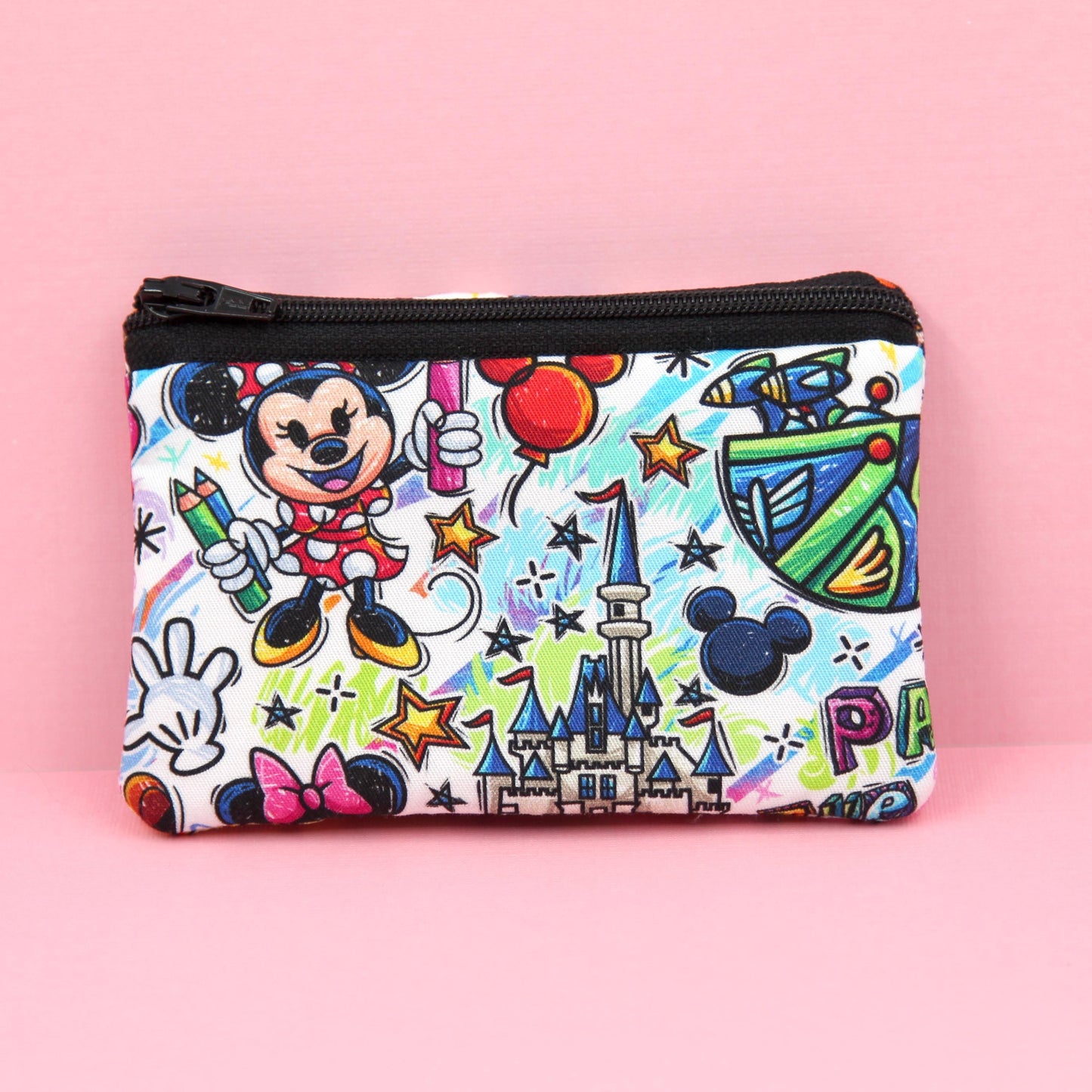 Handmade zipper pouch featuring an art-inspired design with colorful characters and paint details, perfect for holding coins, cards, and other small essentials. Ideal for theme park visits or as a creative gift for art lovers.