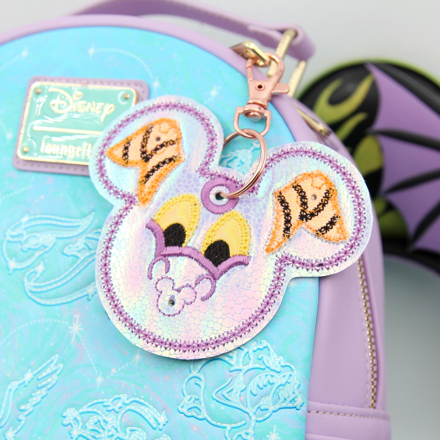 Small Iridescent Dragon Figment-Inspired Pin Trading Keychain β Embroidered Pin Holder with Cork Backing for Enamel Pins - Theme Park Pin