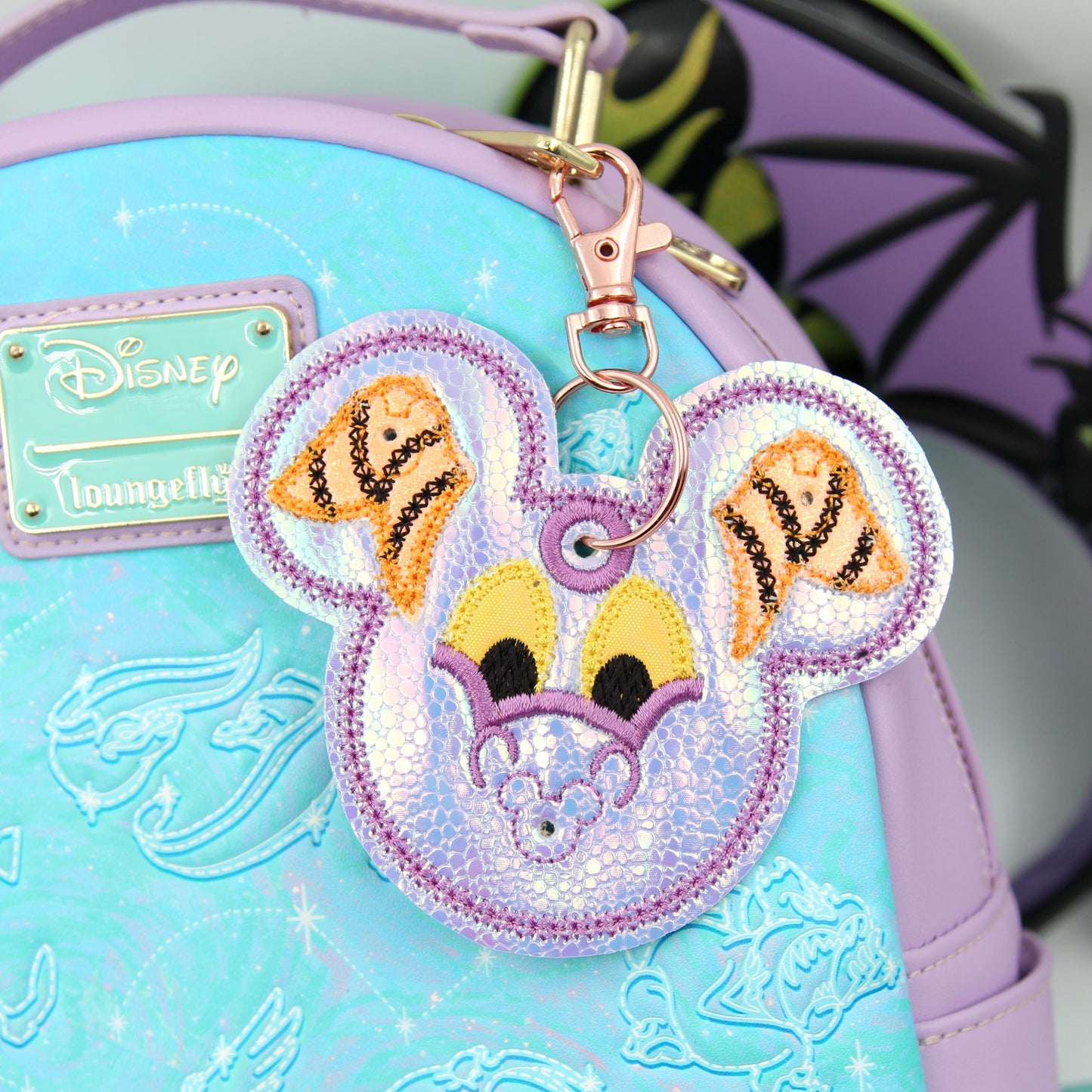 Small Iridescent Dragon Figment-Inspired Pin Trading Keychain β Embroidered Pin Holder with Cork Backing for Enamel Pins - Theme Park Pin
