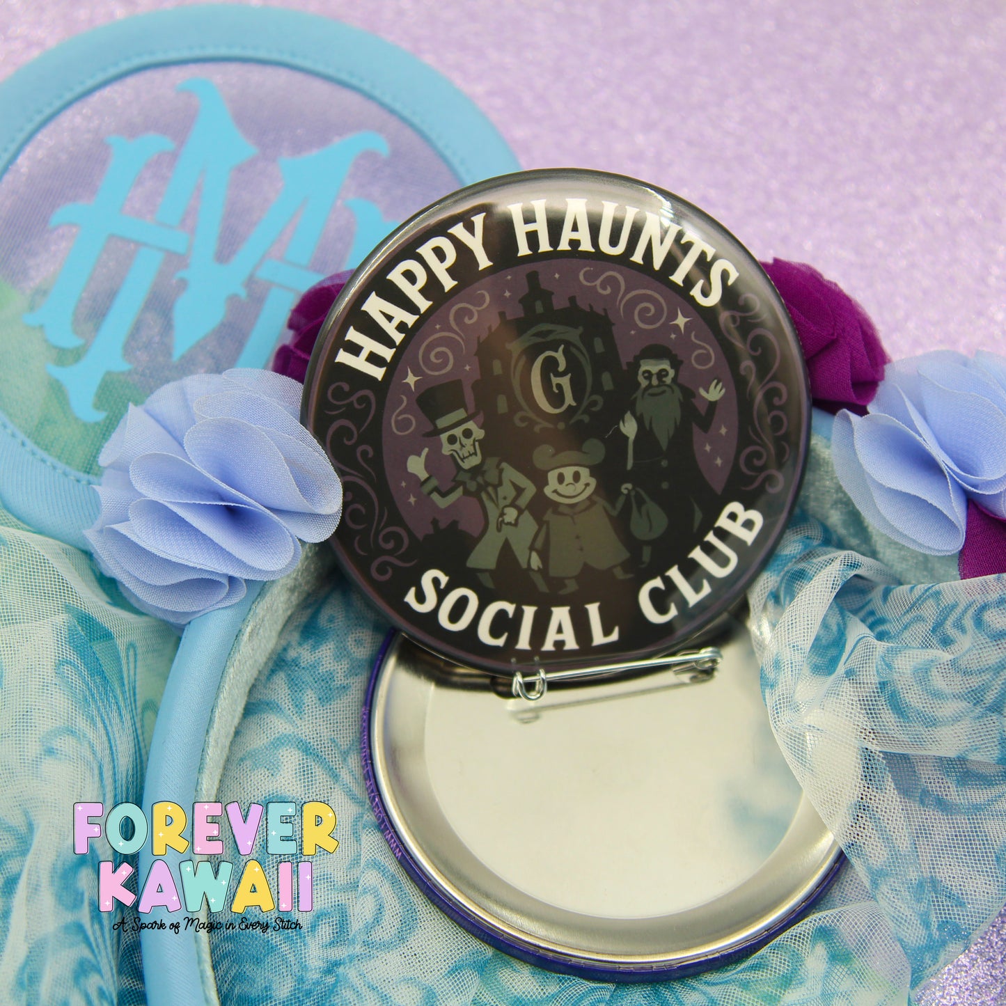 a circular badge with the text "HAPPY HAUNTS SOCIAL CLUB" and a design of a skeleton and a castle. The badge is surrounded by a blue ribbon and a purple flower.