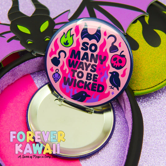 A pin with a pink and purple design featuring a dragon, flames, and various other symbols, along with the text "So many ways to be Wicked" and "FREVER KAWAI" printed on it.