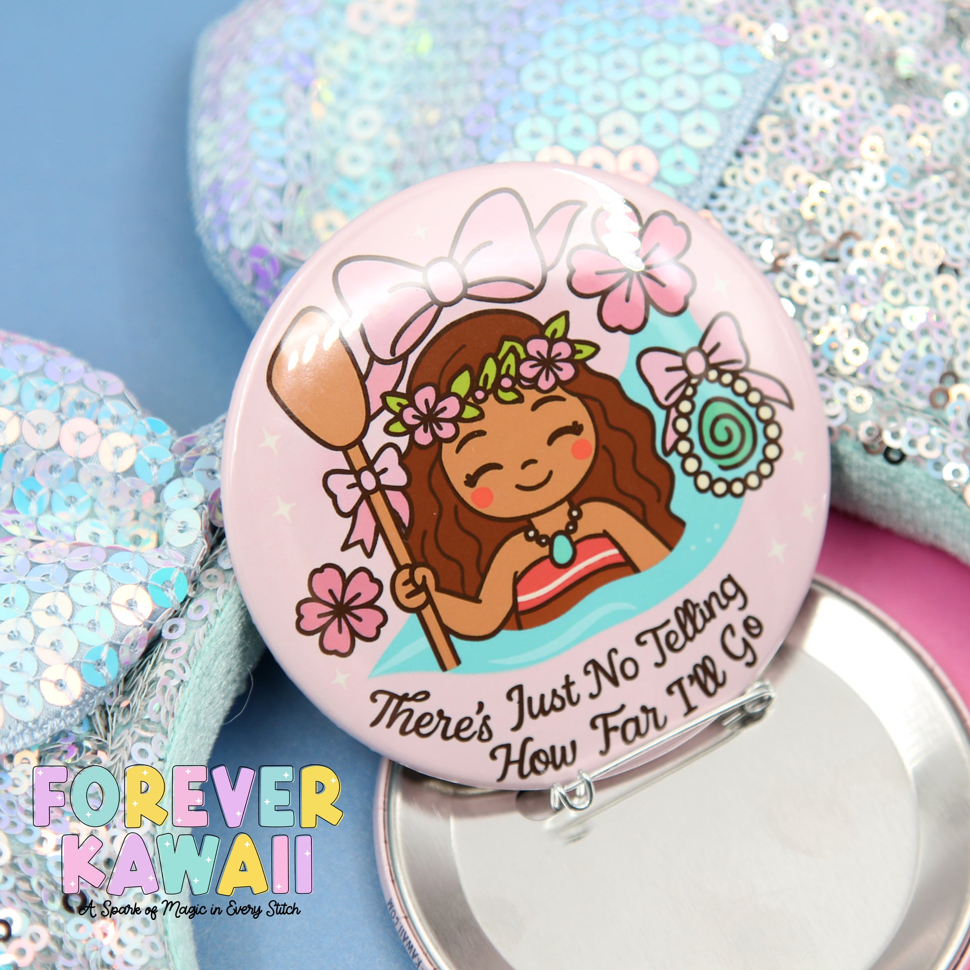 A pink pin with a cartoon girl wearing a flower crown and holding a broom, surrounded by flowers and text that says "There's Just No Telling How Far I'll Go".