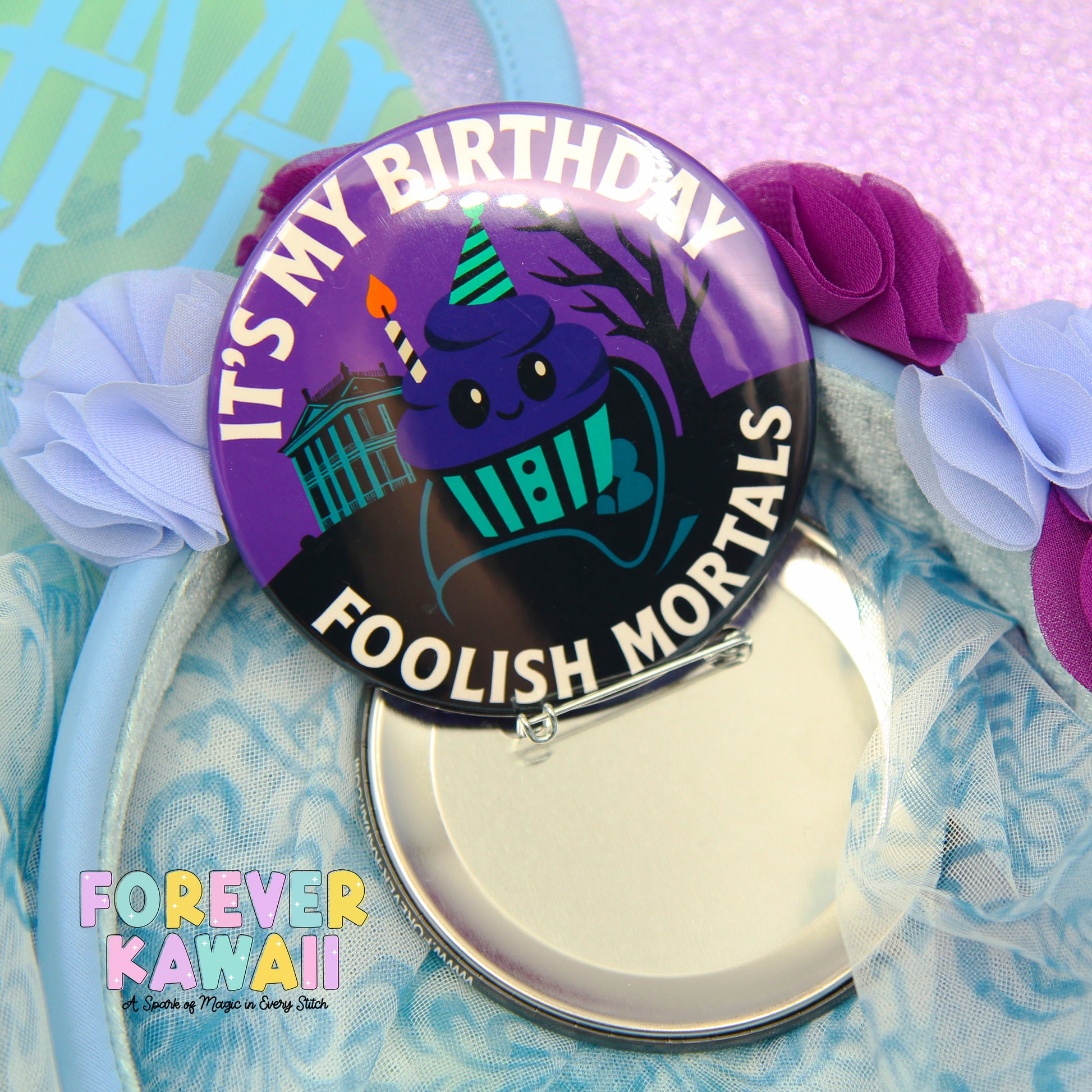A purple badge with a cartoon character and text, surrounded by flowers and a blue background.