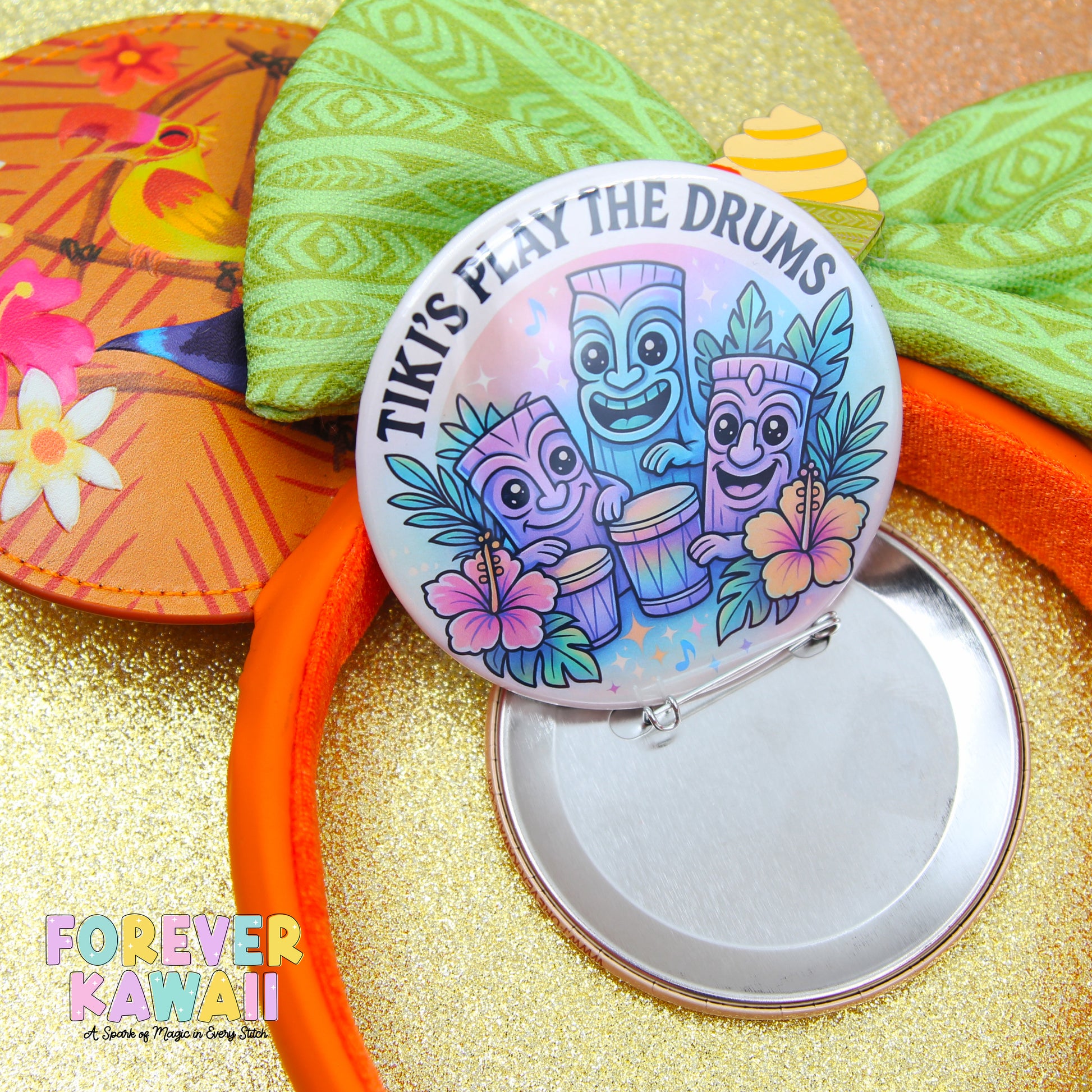 a colorful pin with a tiki theme, surrounded by other colorful objects such as a flower, a bird, and a tiki mask.