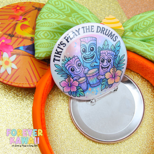 a colorful pin with a tiki theme, surrounded by other colorful objects such as a flower, a bird, and a tiki mask.