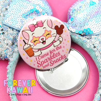 A pink button featuring a cartoon cat holding a cup and surrounded by sparkles and stars, with the text "I Came for the Sparkles and Snacks" and the phrase "FREVER KAWAI" below it.