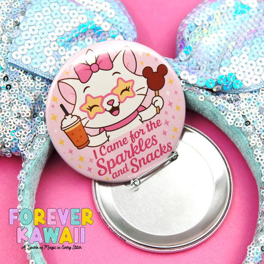 A pink button featuring a cartoon cat holding a cup and surrounded by sparkles and stars, with the text "I Came for the Sparkles and Snacks" and the phrase "FREVER KAWAI" below it.