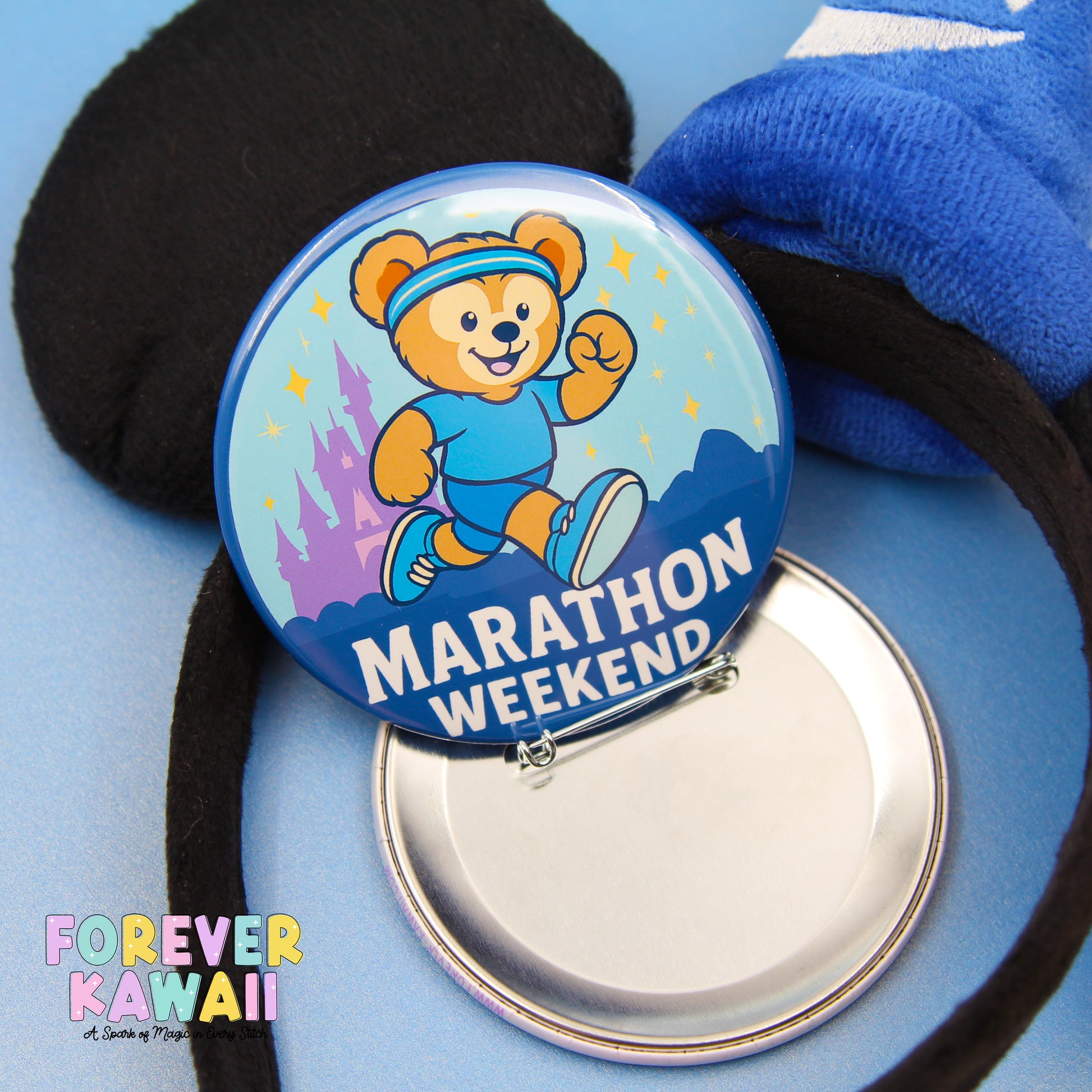A round blue button with a cartoon bear and the text "Marathon Weekend" is shown, along with a black object and a blue object in the background.