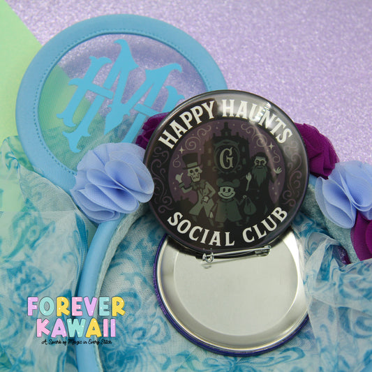 a round mirror with a black frame and a blue rim, surrounded by various decorative elements such as flowers and a light blue background.