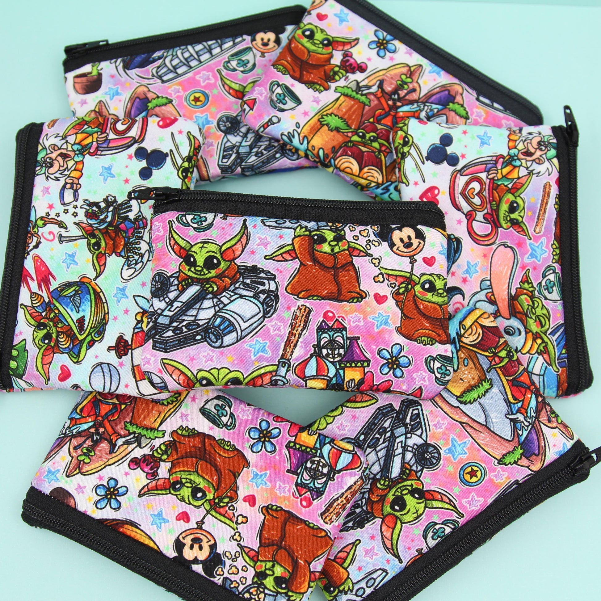 Handmade Baby Alien zipper pouch in whimsical theme park design, perfect for holding cash, cards, and passes