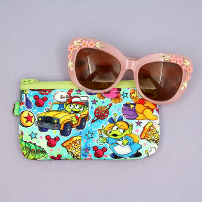 Handmade zipper pouch featuring a Baby Grogu-inspired character enjoying theme park rides, perfect for protecting eyeglasses, sunglasses, makeup essentials, or small travel items.
