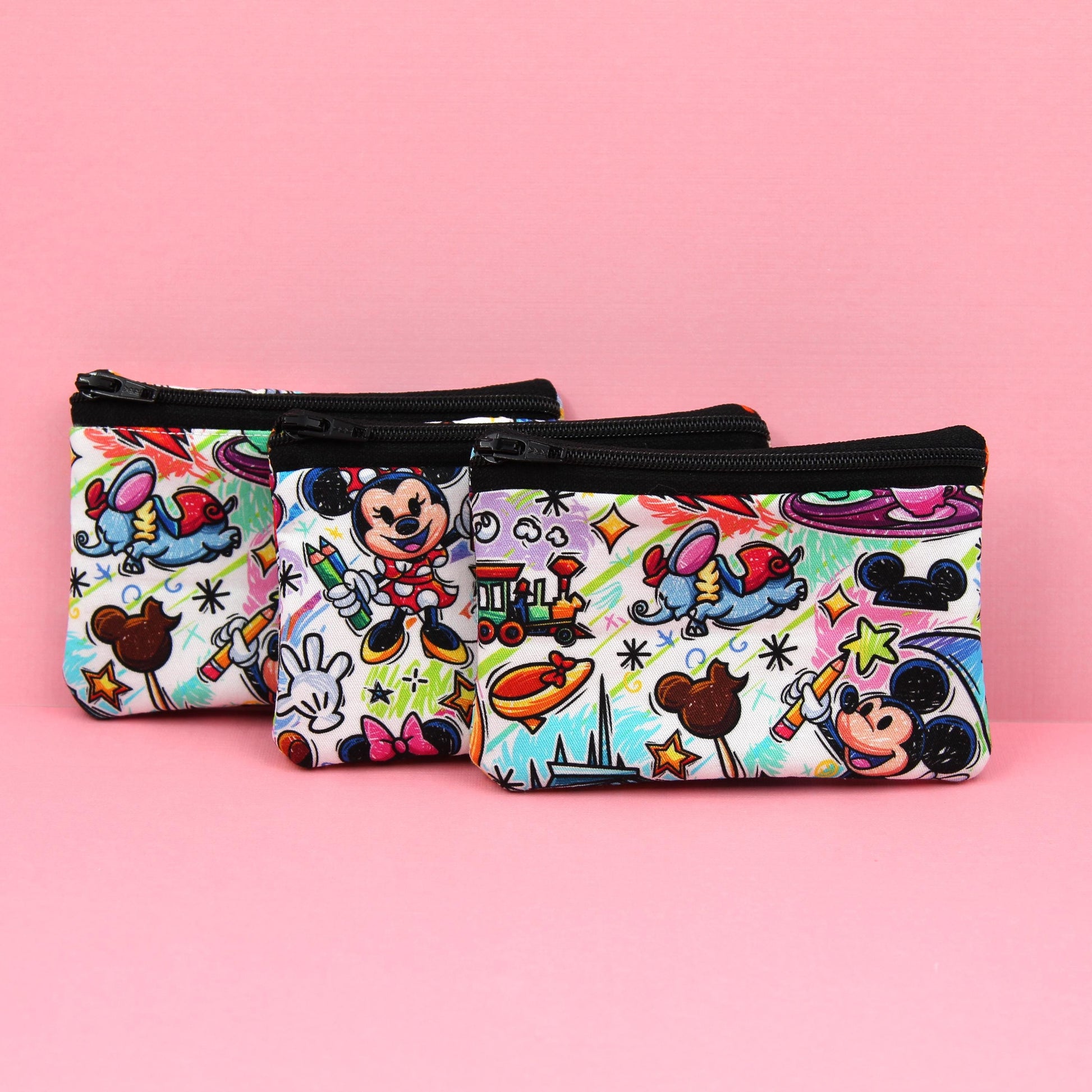 Handmade zipper pouch featuring an art-inspired design with colorful characters and paint details, perfect for holding coins, cards, and other small essentials. Ideal for theme park visits or as a creative gift for art lovers.